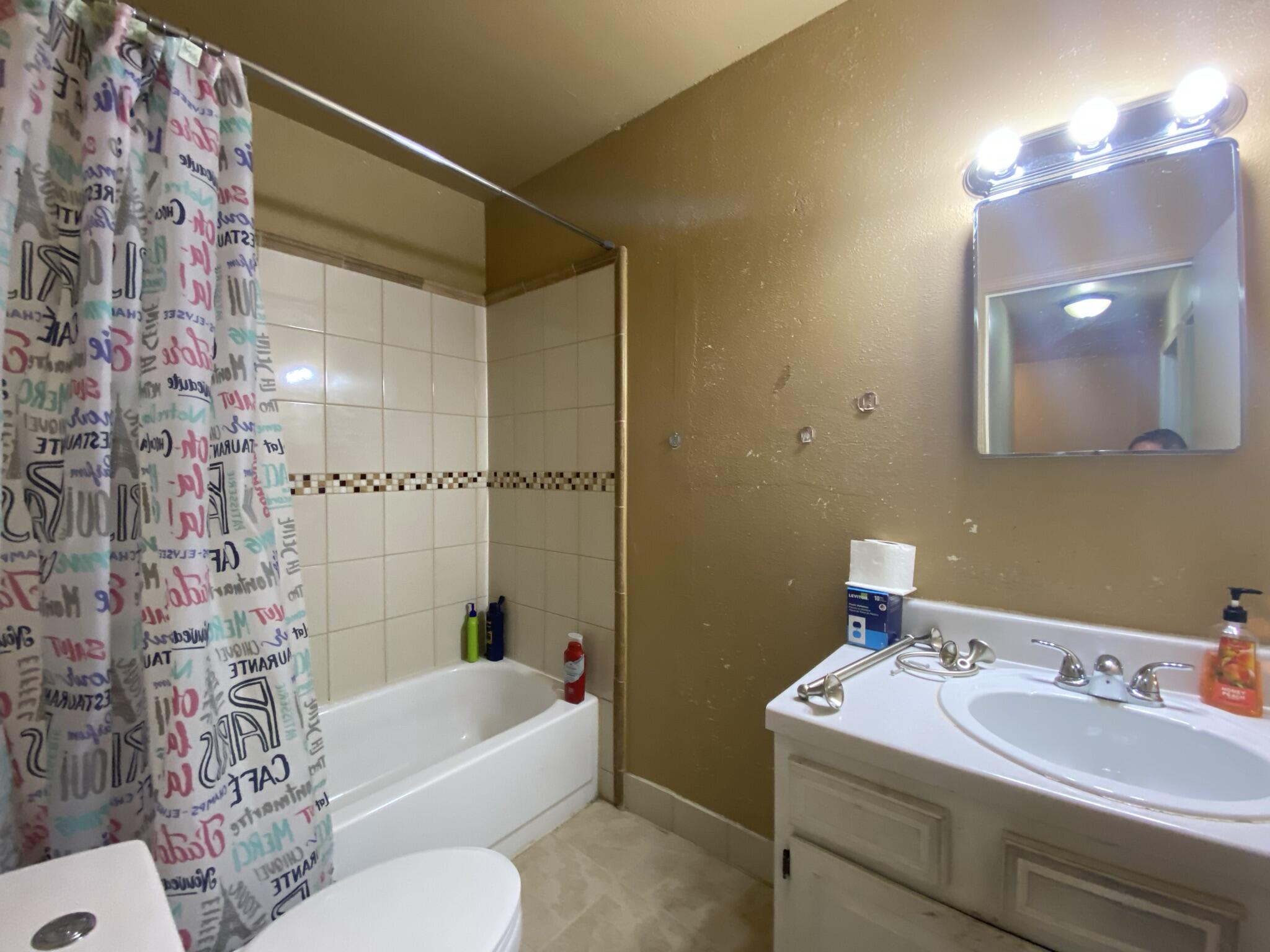 2312 Ranch Road Northwest Roanoke, VA 24017 - Photo 16 of 27 a bathroom with a sink toilet and shower