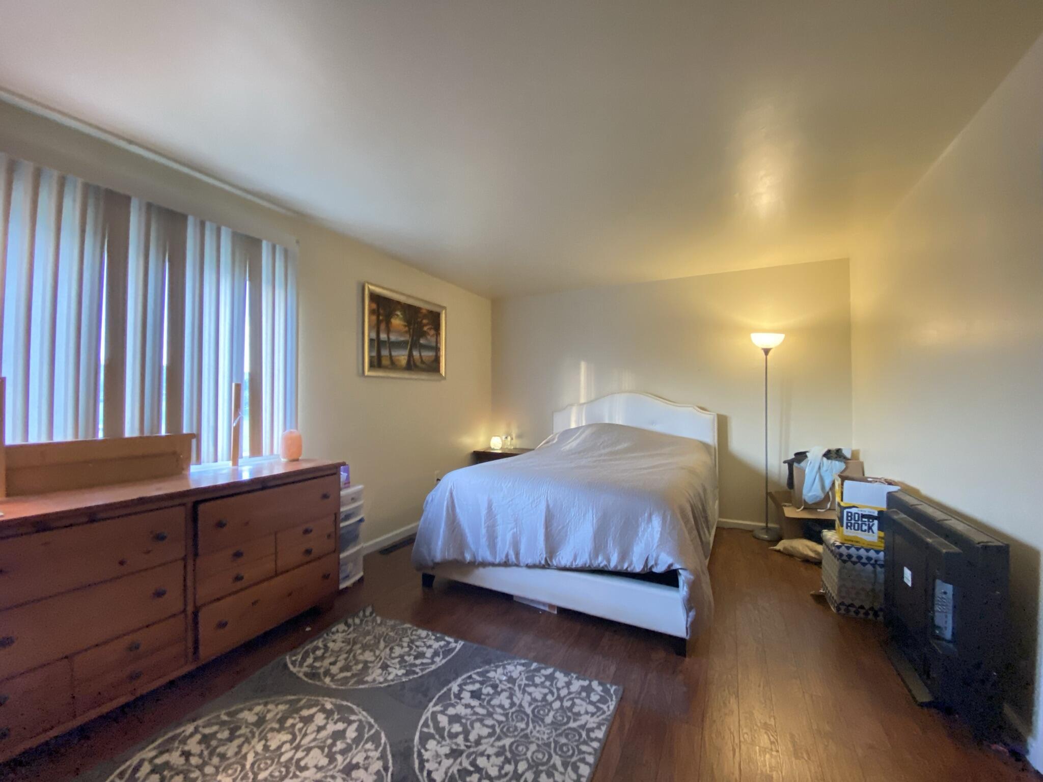 2312 Ranch Road Northwest Roanoke, VA 24017 - Photo 17 of 27 a bedroom with a bed and wooden floor