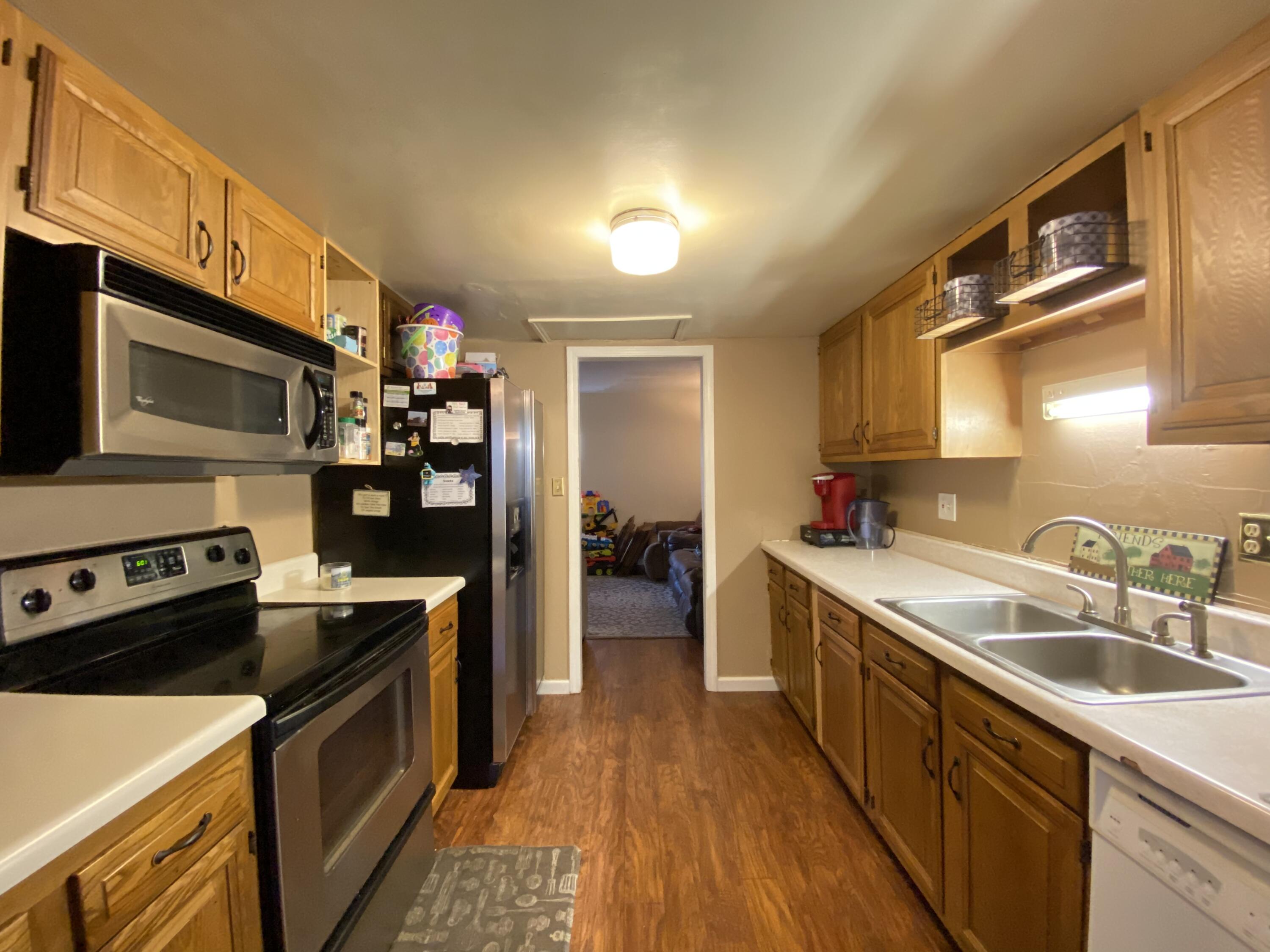 2312 Ranch Road Northwest Roanoke, VA 24017 - Photo 5 of 27 a kitchen with a sink stove and cabinets