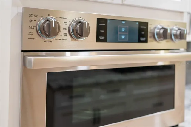 a kitchen with a stove and a refrigerator