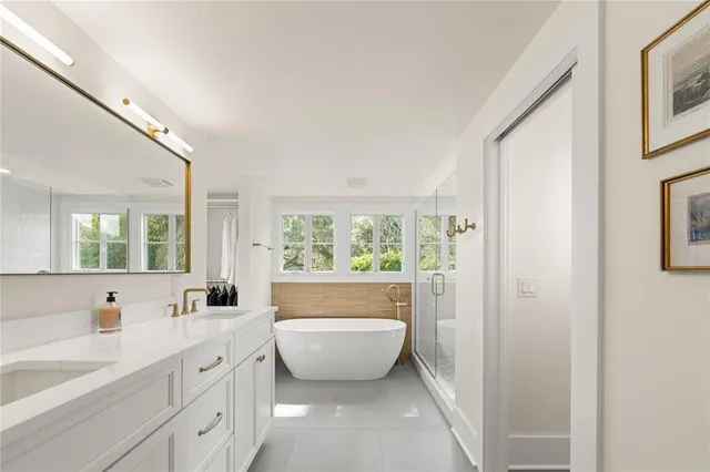 a bathroom with a bathtub and a shower