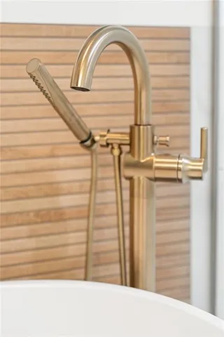 a white toilet sitting next to a bathroom sink