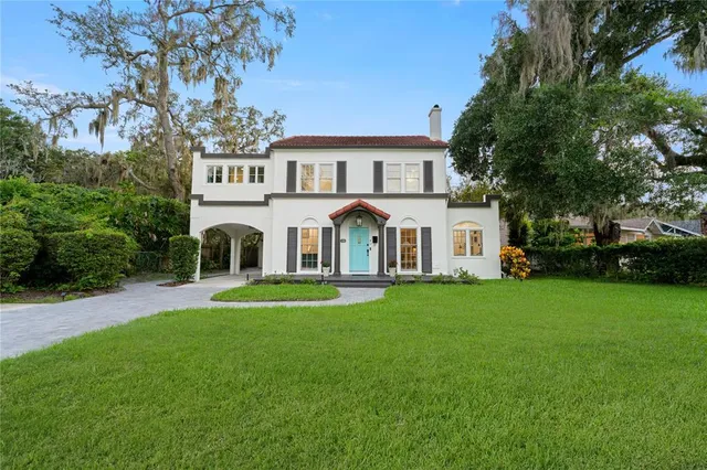 a view of a house with a street
