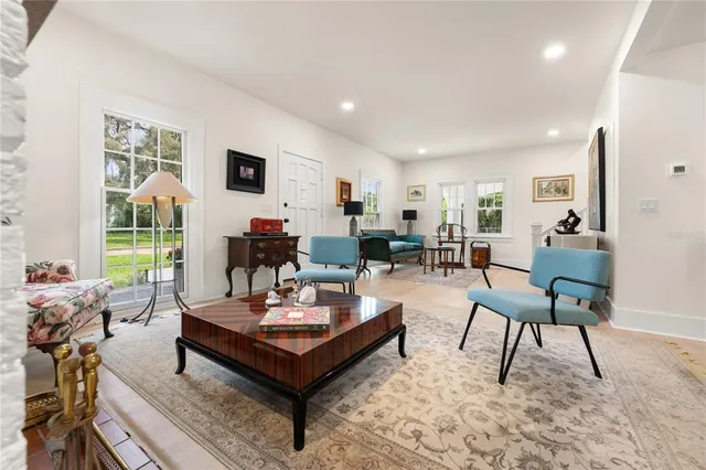 a living room with furniture and a table
