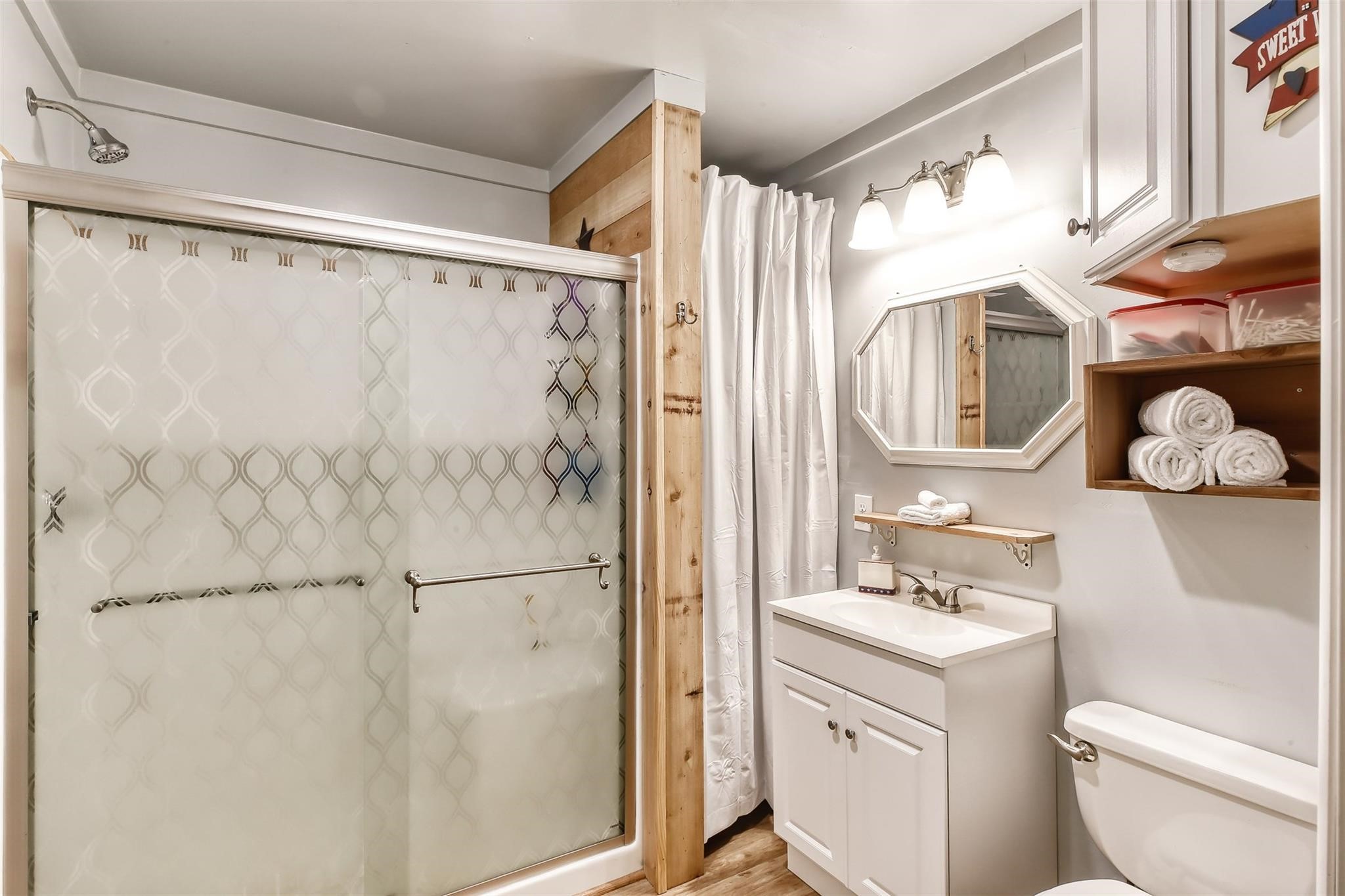 14676 Duke Road Splendora, TX 77372 - Photo 10 of 14 a bathroom with a sink vanity mirror and toilet