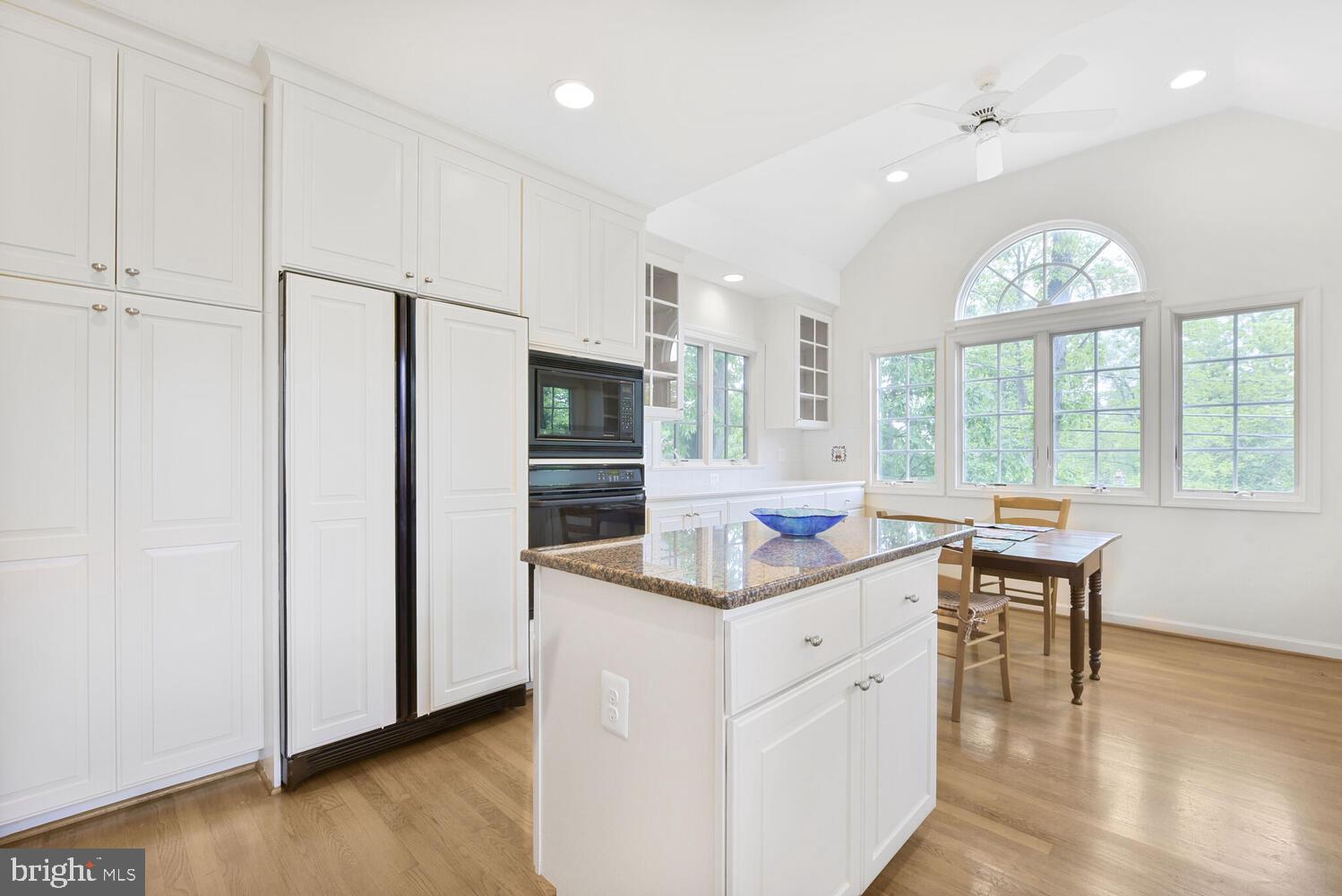 3901 Ridge Road Annandale, VA 22003 - Photo 12 of 21 a kitchen with stainless steel appliances granite countertop a white cabinets and wooden floor