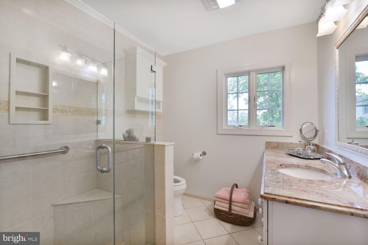 3901 Ridge Road Annandale, VA 22003 - Photo 16 of 21 a bathroom with a granite countertop sink mirror and double