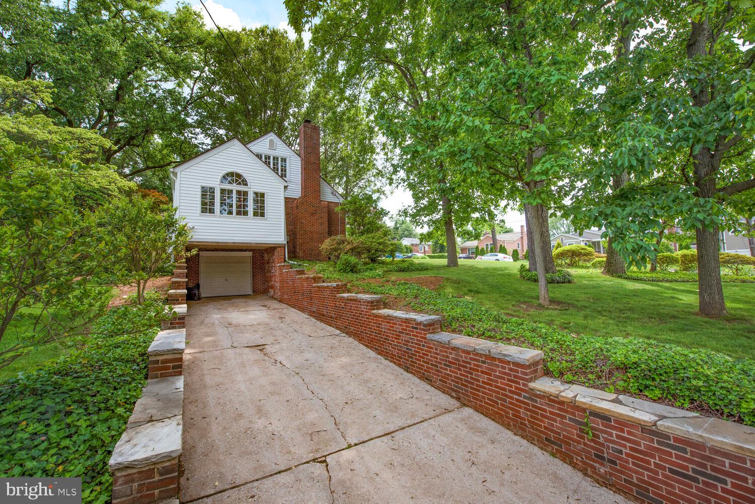 3901 Ridge Road Annandale, VA 22003 - Photo 3 of 21 a front view of a house with yard and green space