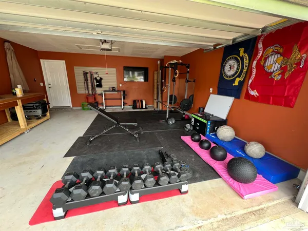 a room with lots of gym equipment