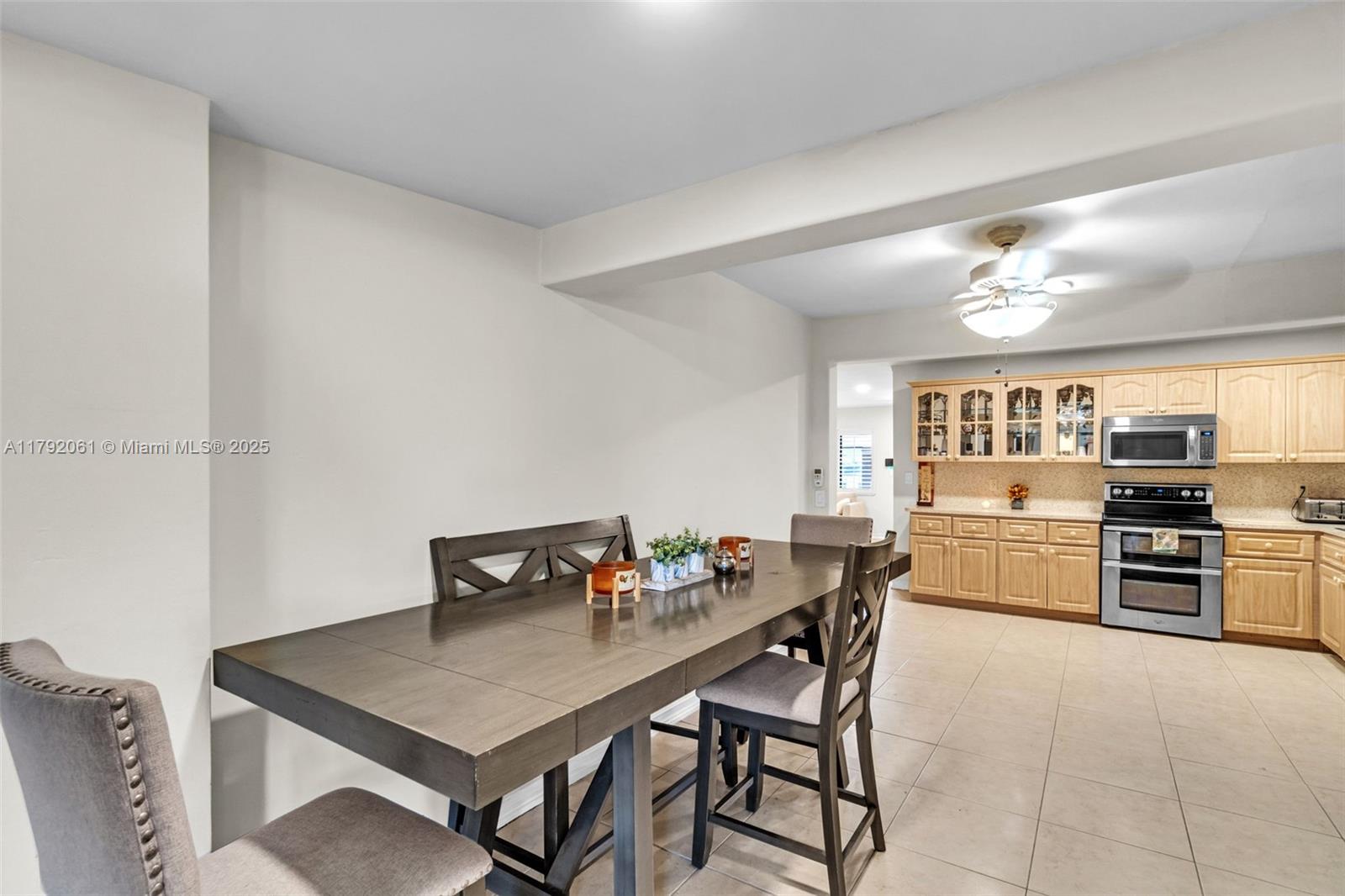 30021 Southwest 160th Avenue Homestead, FL 33033 - Photo 14 of 55 a kitchen with a table and chairs in it