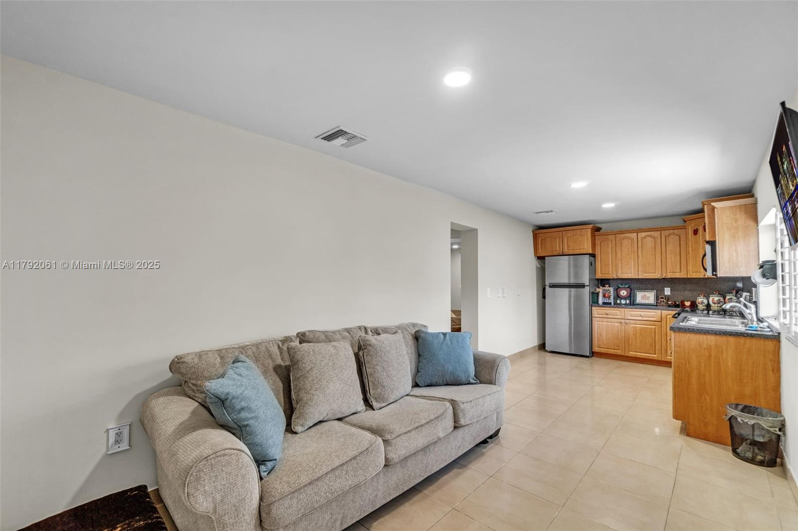 30021 Southwest 160th Avenue Homestead, FL 33033 - Photo 16 of 55 a living room with furniture and kitchen view