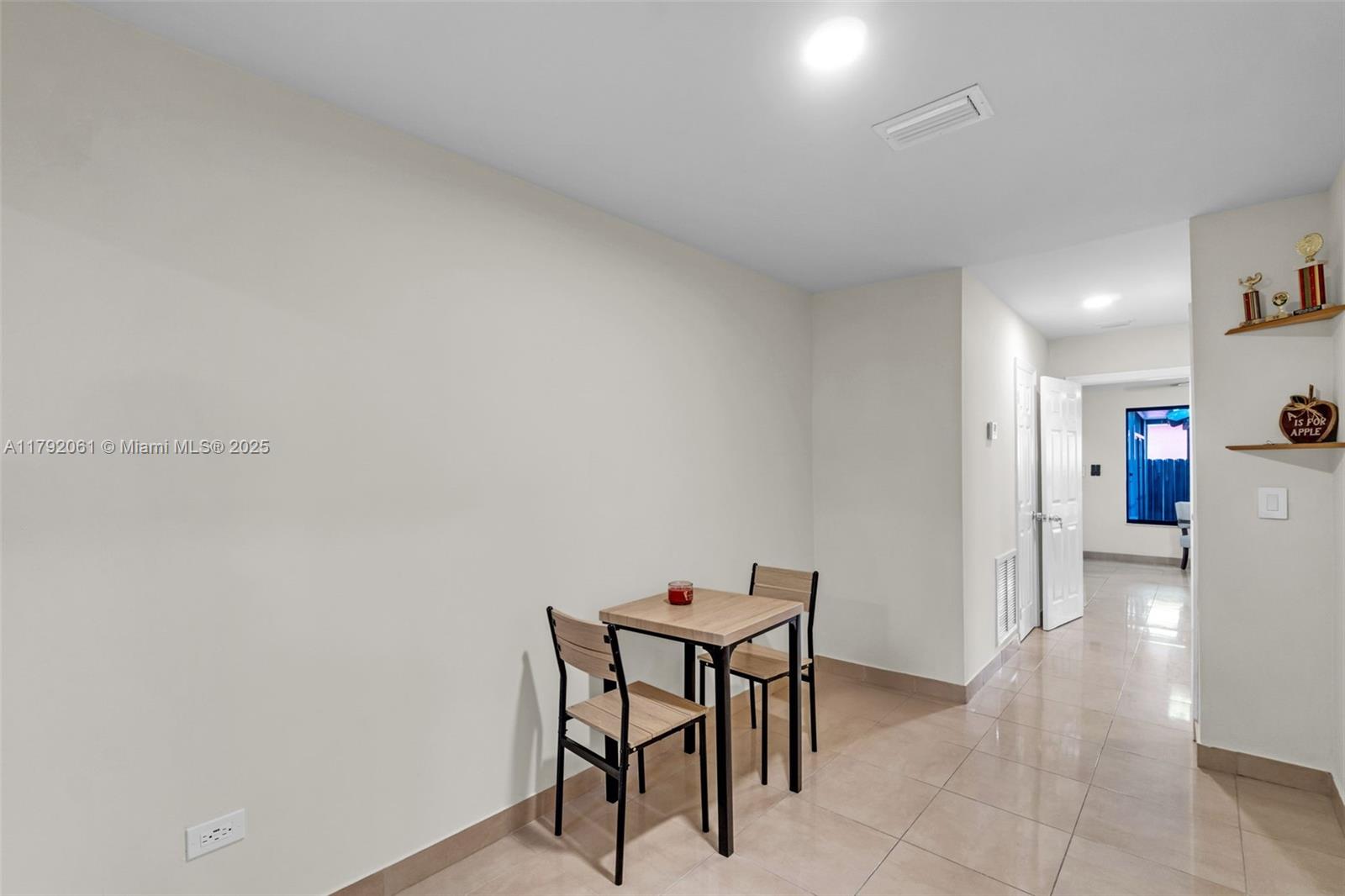 30021 Southwest 160th Avenue Homestead, FL 33033 - Photo 19 of 55 a view of a room with furniture and a dining table