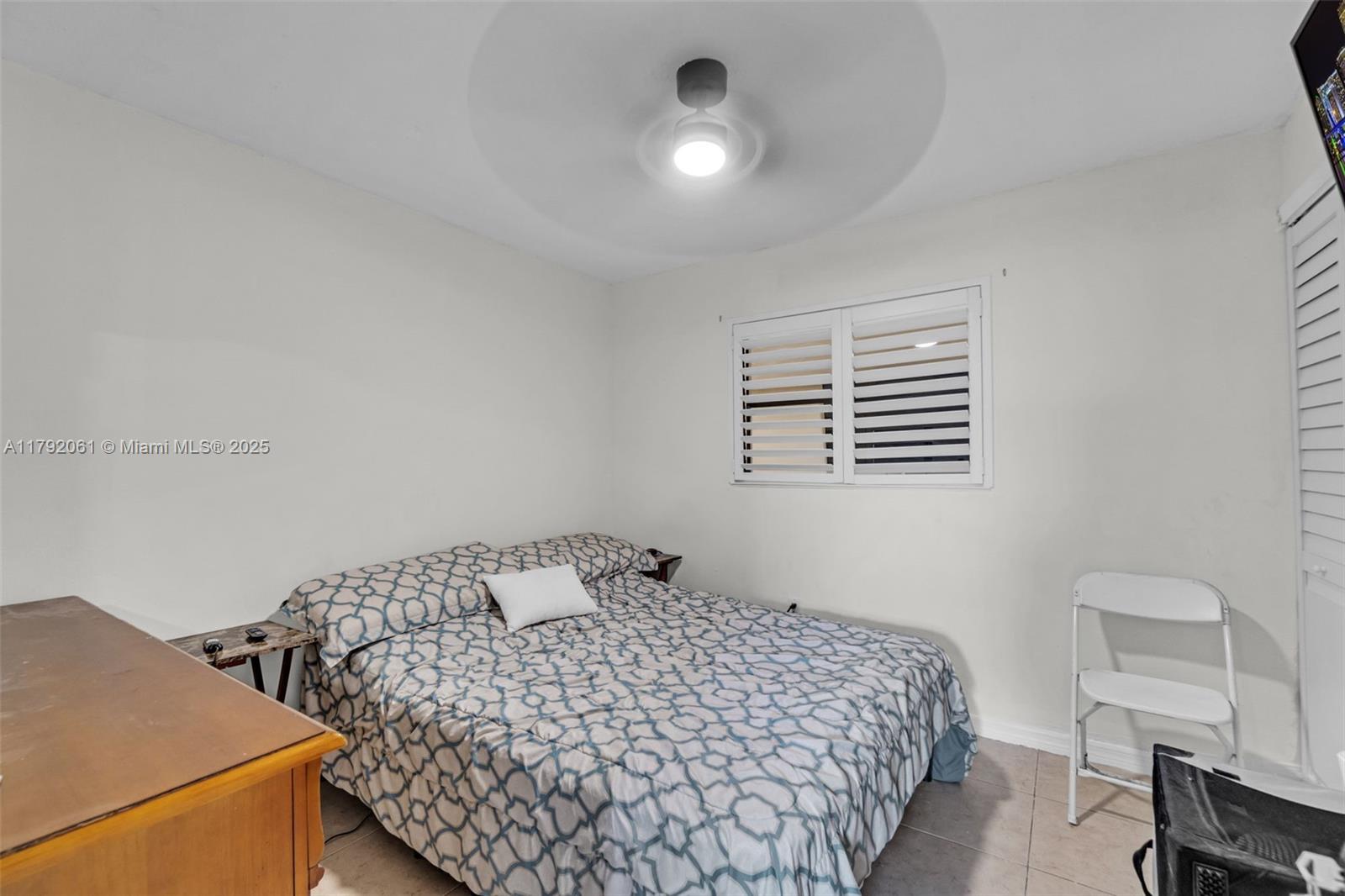 30021 Southwest 160th Avenue Homestead, FL 33033 - Photo 21 of 55 a bedroom with a bed and a window