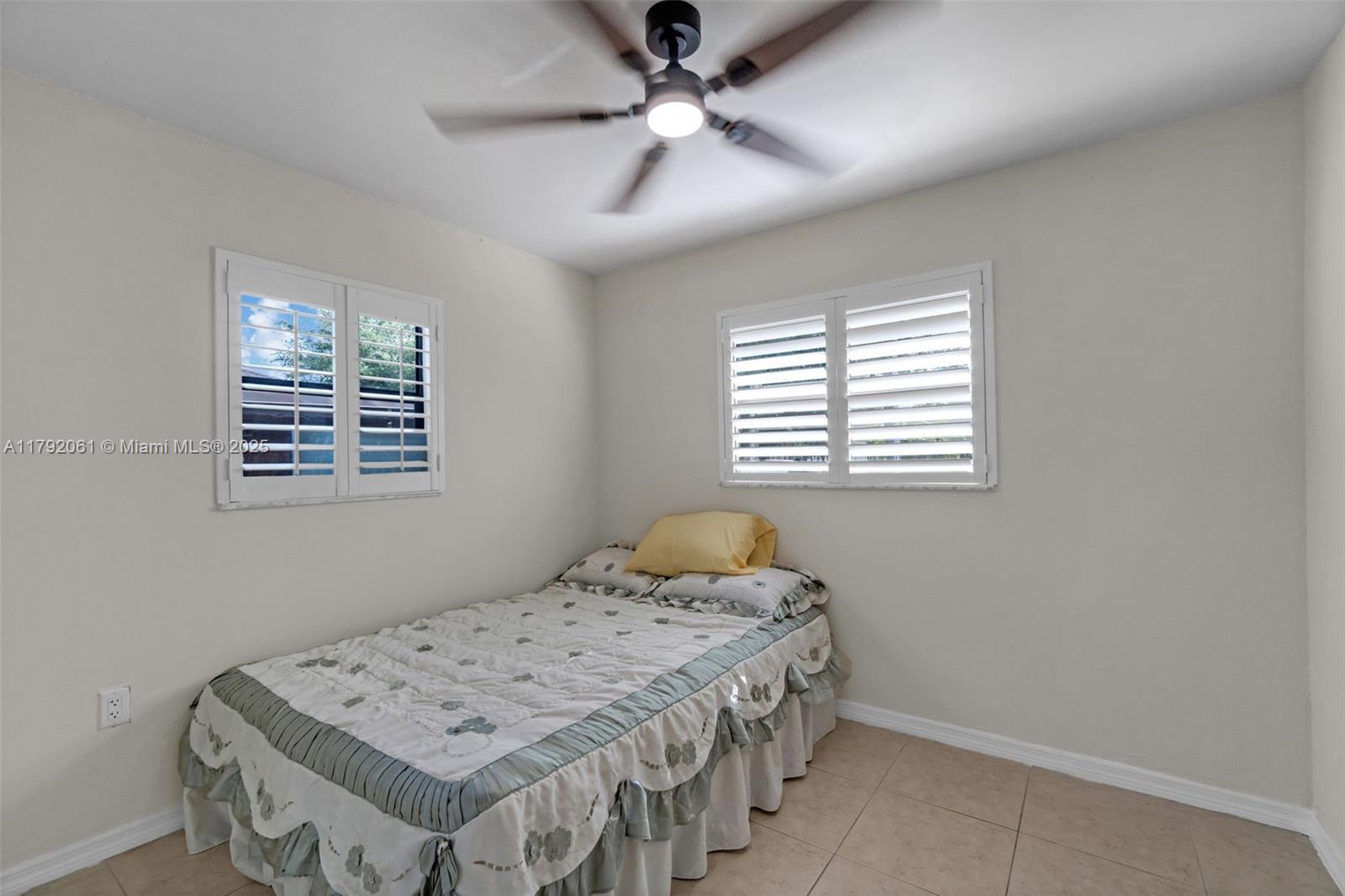 30021 Southwest 160th Avenue Homestead, FL 33033 - Photo 24 of 55 a bedroom with a bed and a window