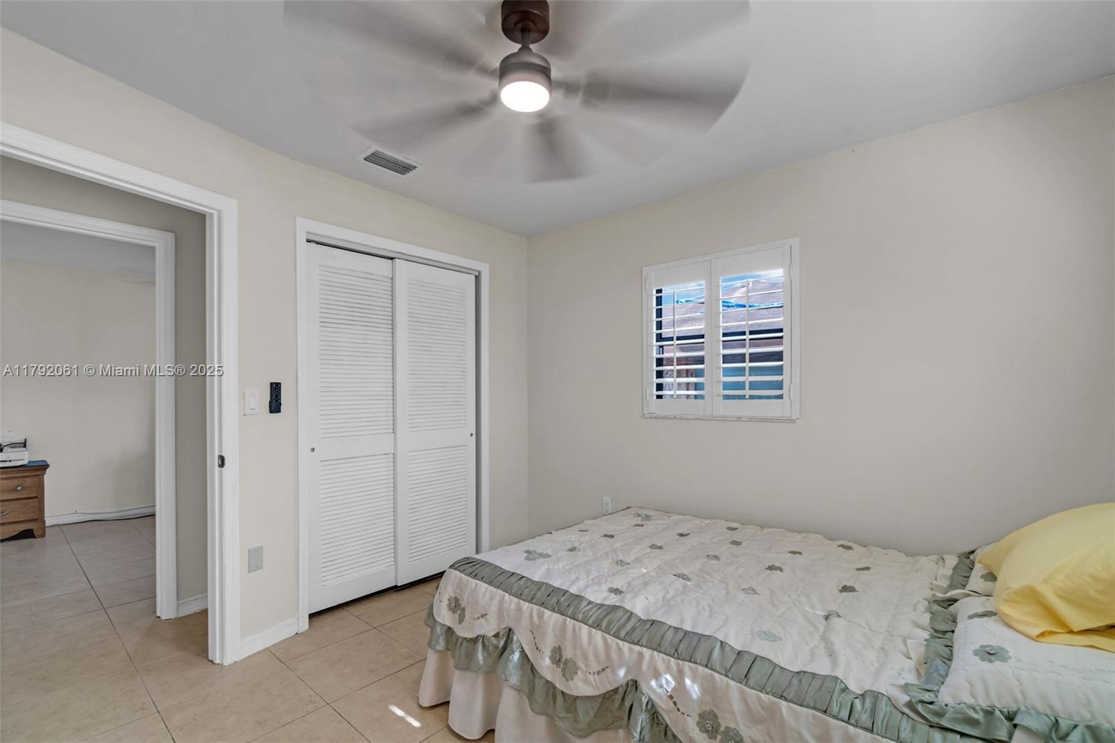 30021 Southwest 160th Avenue Homestead, FL 33033 - Photo 25 of 55 a bedroom with a bed and a window