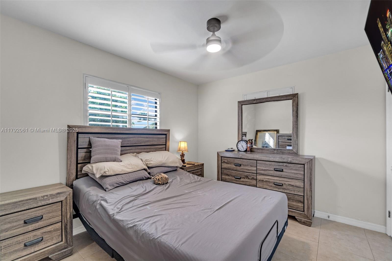 30021 Southwest 160th Avenue Homestead, FL 33033 - Photo 27 of 55 a bedroom with a bed and a dresser