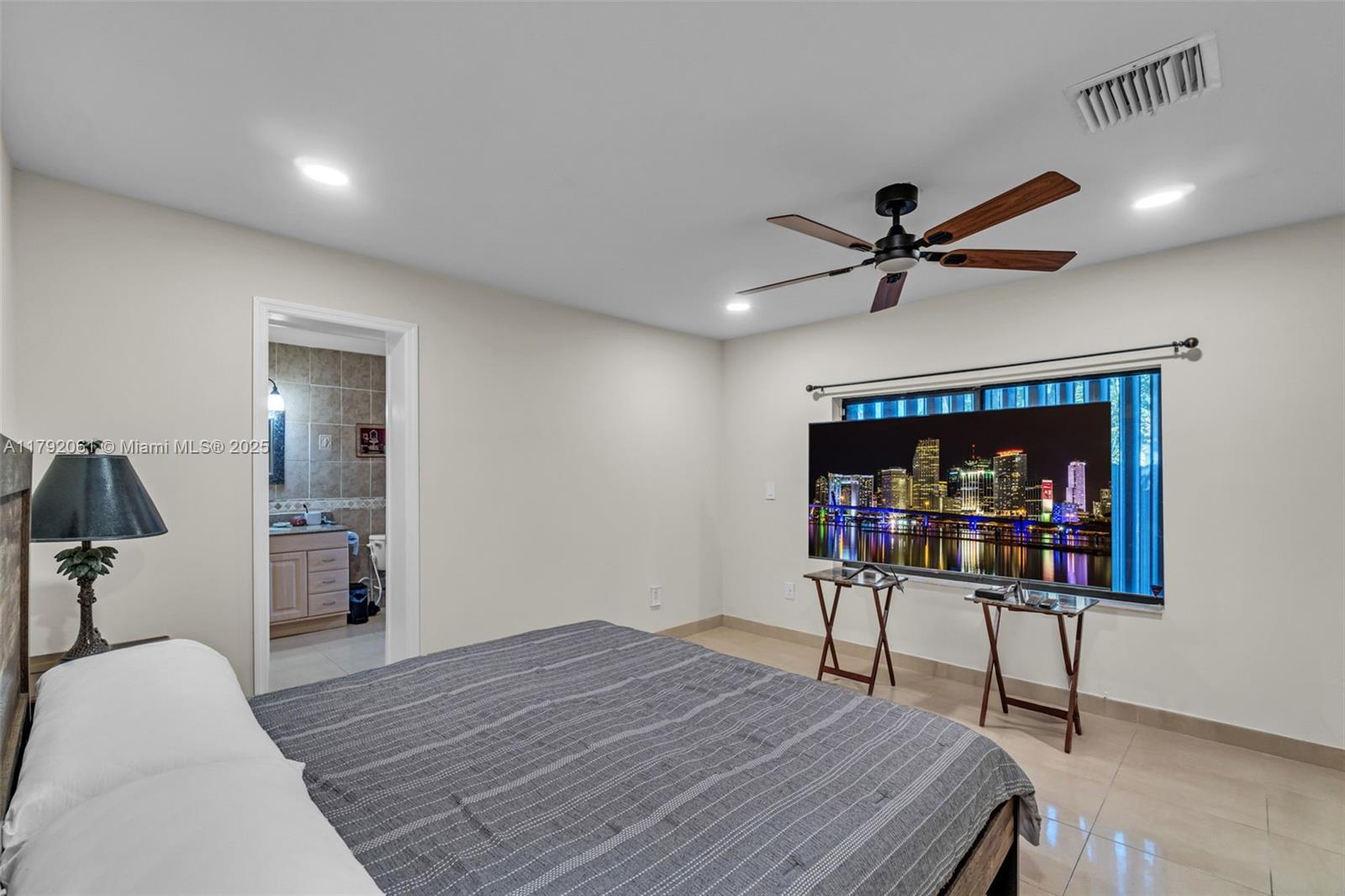 30021 Southwest 160th Avenue Homestead, FL 33033 - Photo 33 of 55 a bedroom with a bed and a table