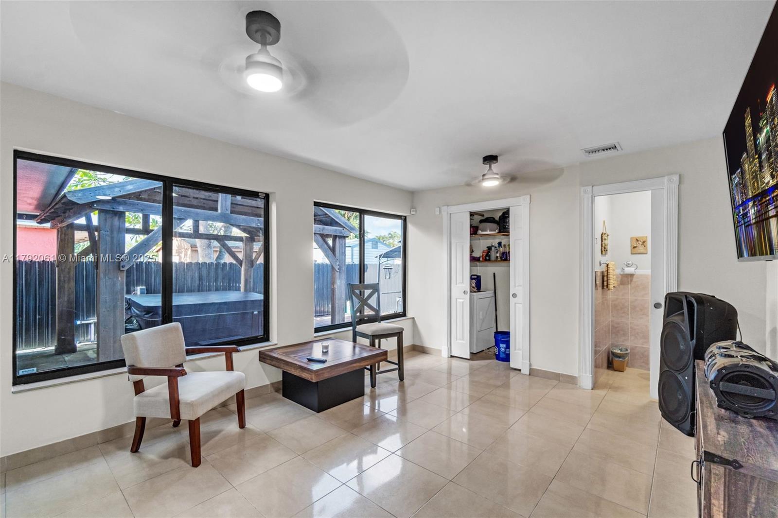 30021 Southwest 160th Avenue Homestead, FL 33033 - Photo 34 of 55 a living room with furniture and large windows