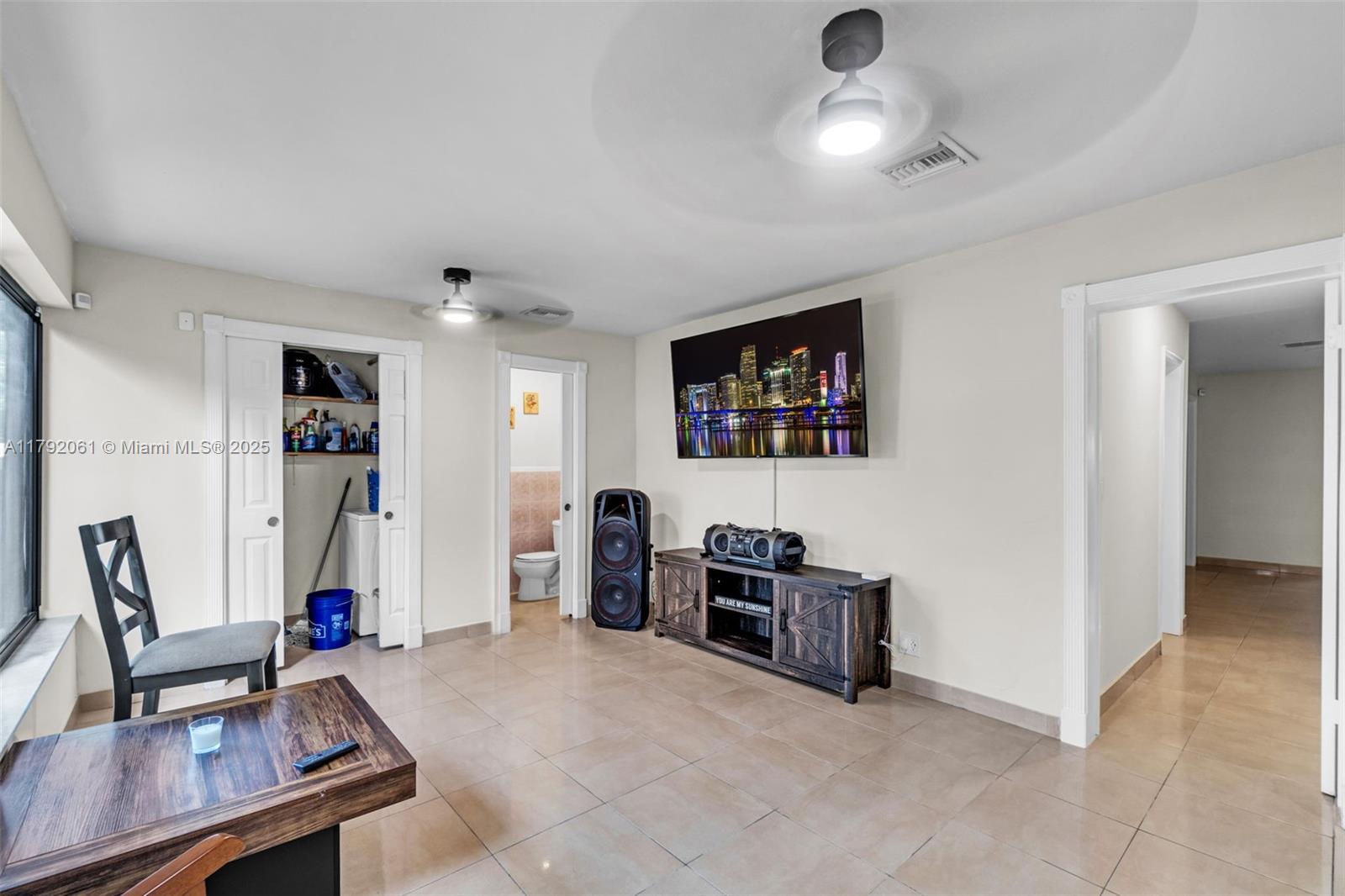 30021 Southwest 160th Avenue Homestead, FL 33033 - Photo 35 of 55 a living room with furniture and a flat screen tv