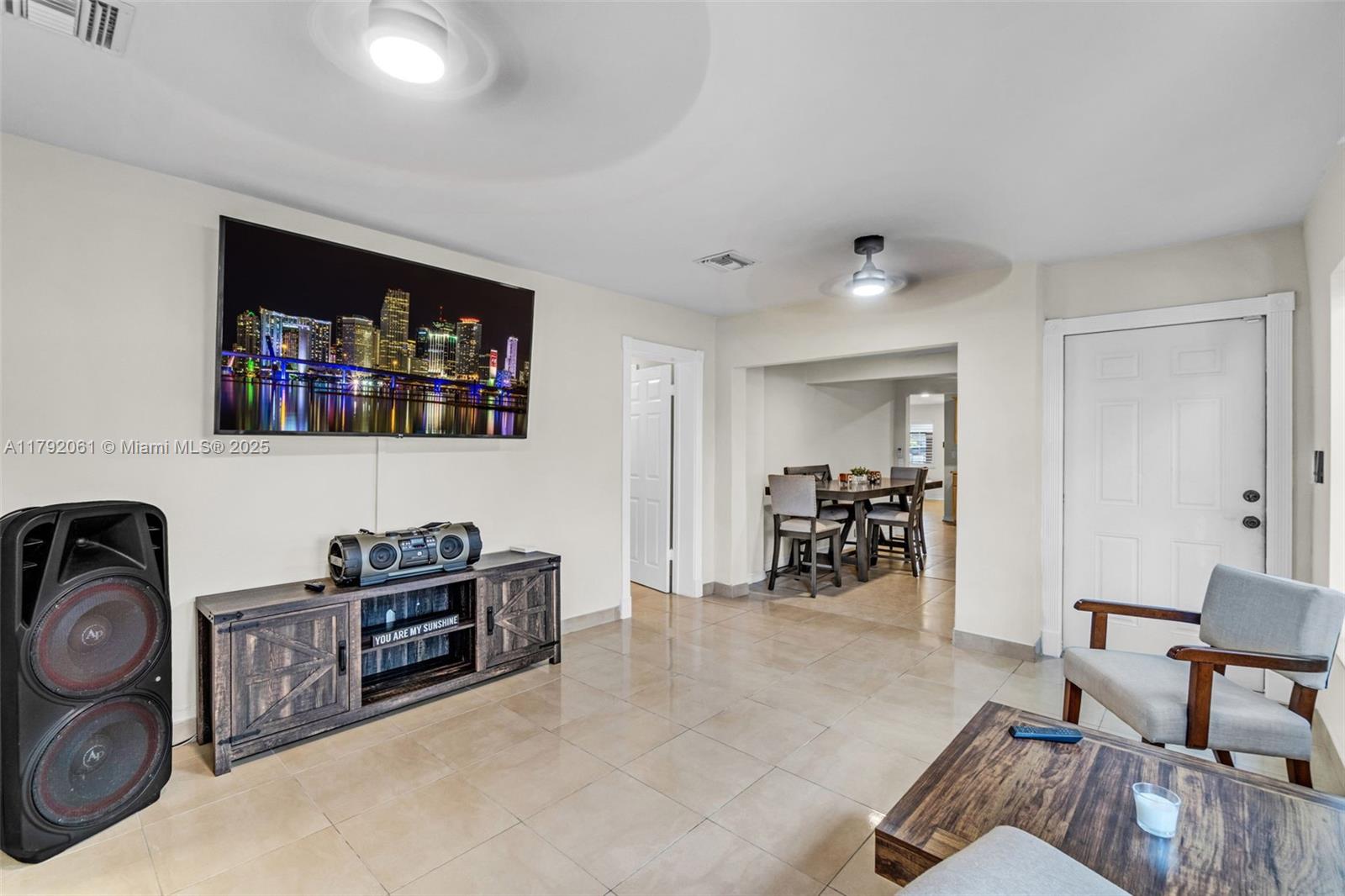 30021 Southwest 160th Avenue Homestead, FL 33033 - Photo 36 of 55 a living room with furniture and a flat screen tv
