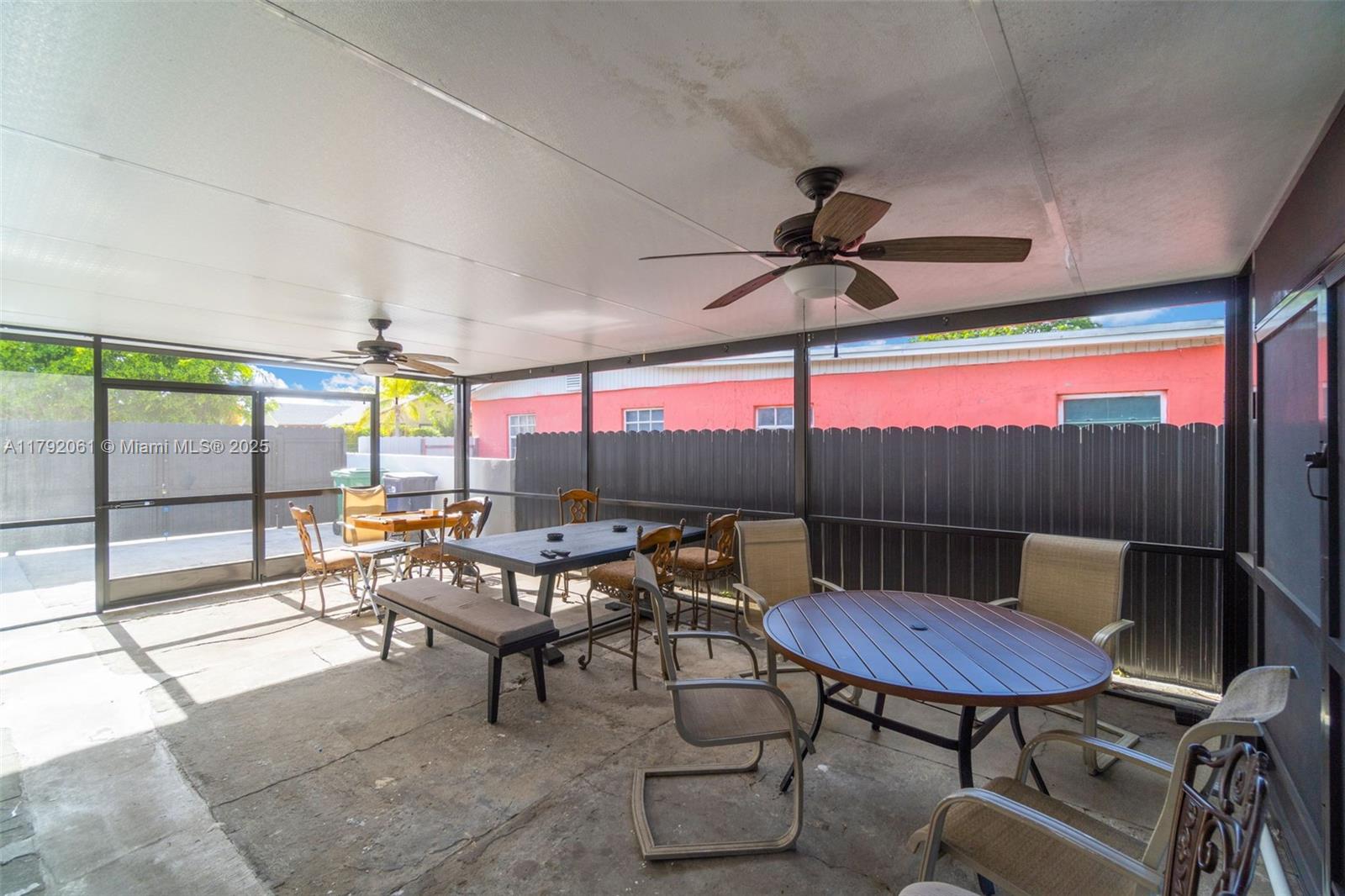 30021 Southwest 160th Avenue Homestead, FL 33033 - Photo 40 of 55 a view of a chairs and table in patio with a barbeque