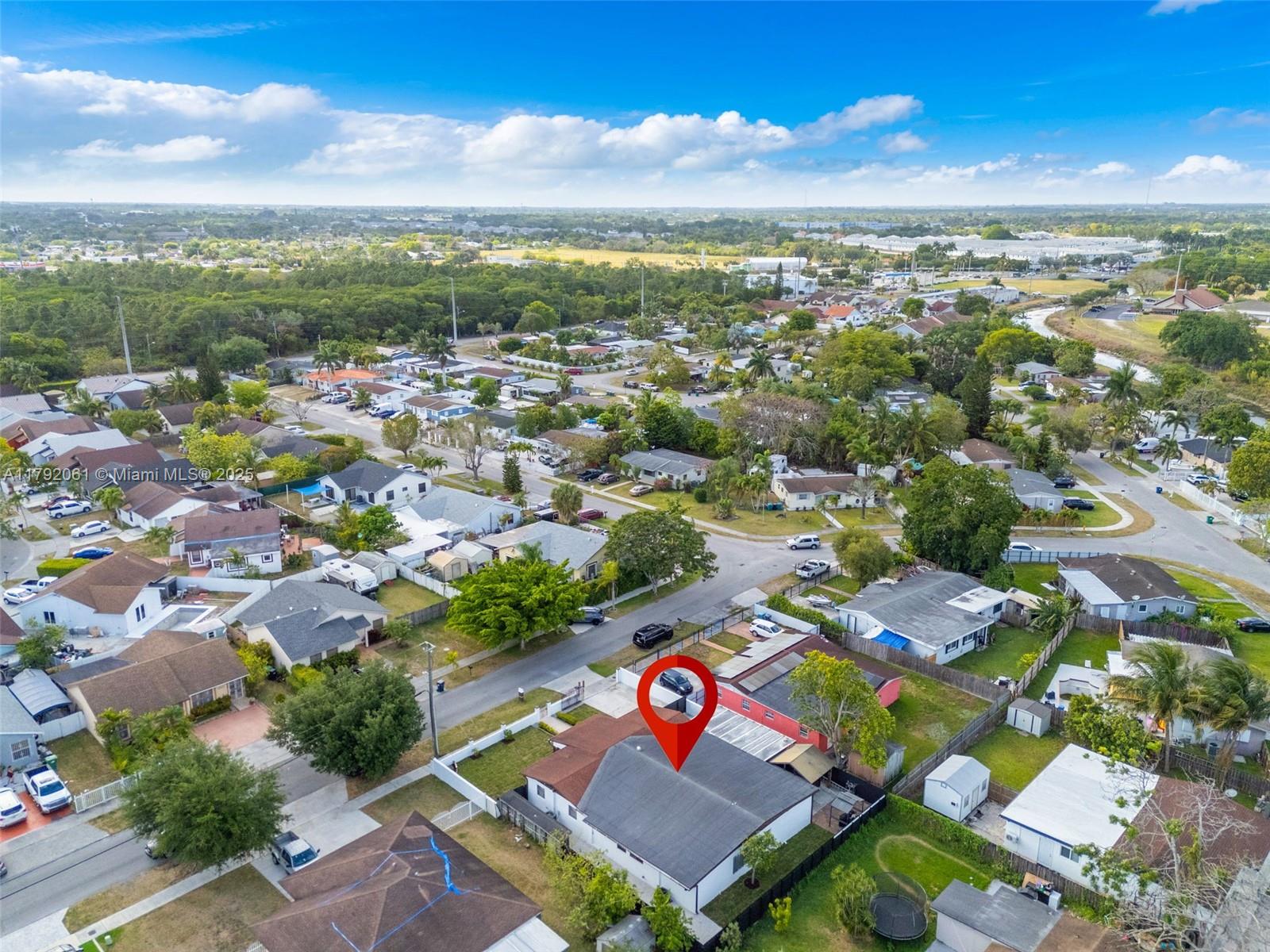 30021 Southwest 160th Avenue Homestead, FL 33033 - Photo 46 of 55 an aerial view of residential houses with outdoor space