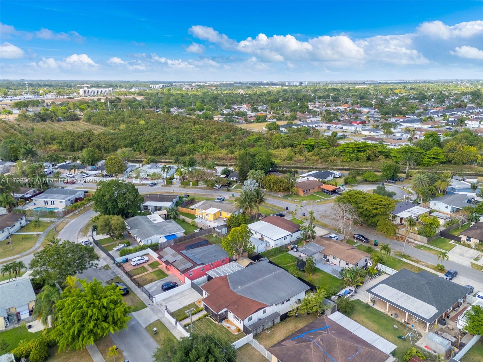 30021 Southwest 160th Avenue Homestead, FL 33033 - Photo 49 of 55 an aerial view of residential houses with outdoor space