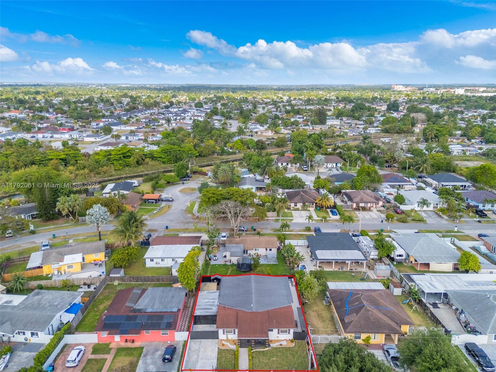 30021 Southwest 160th Avenue Homestead, FL 33033 - Photo 52 of 55 an aerial view of residential houses with outdoor space and street view