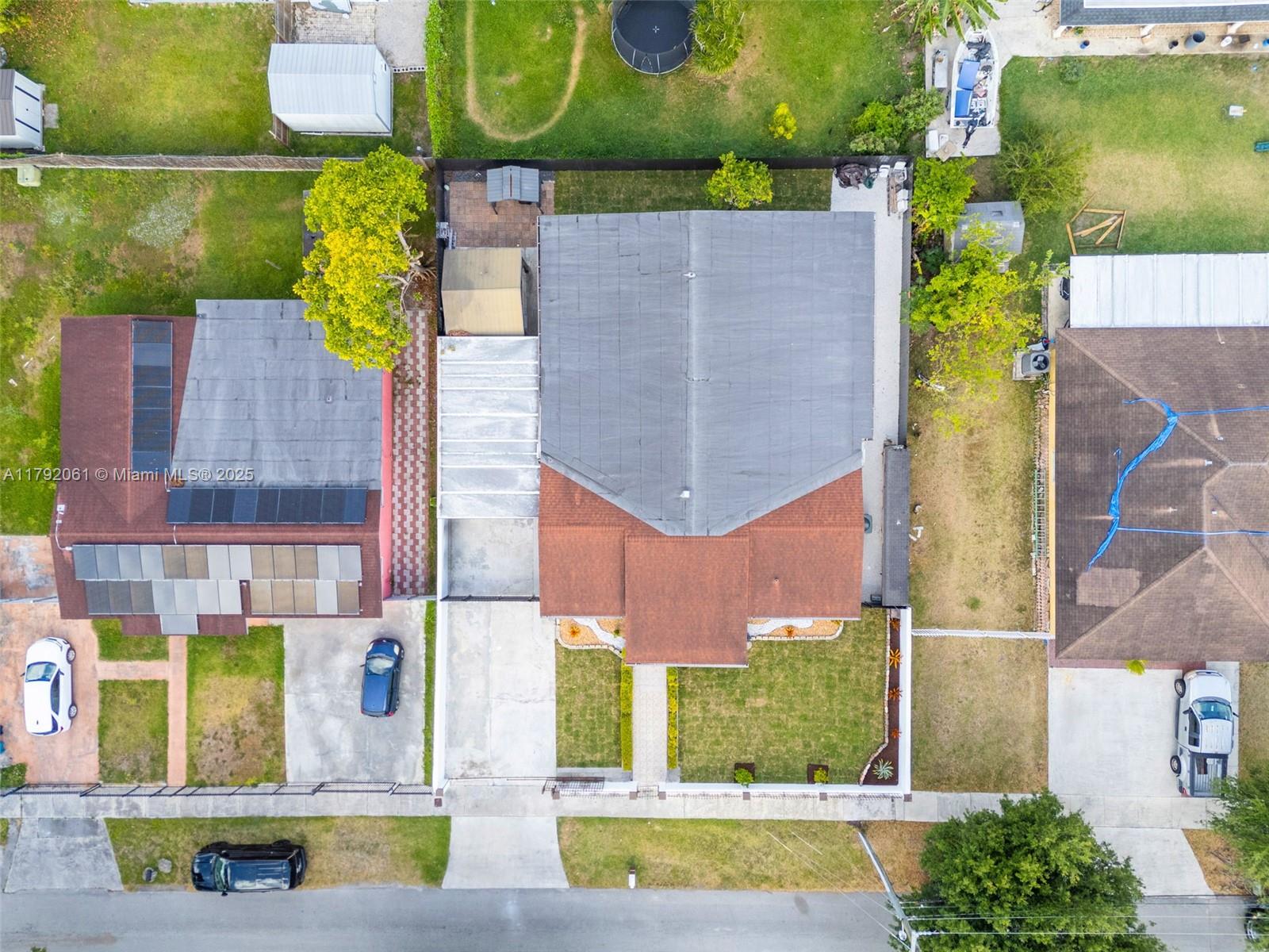 30021 Southwest 160th Avenue Homestead, FL 33033 - Photo 55 of 55 an aerial view of residential houses with outdoor space and street view