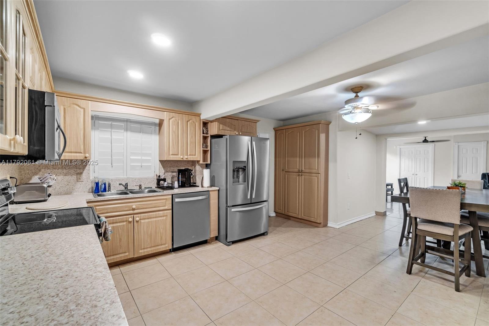 30021 Southwest 160th Avenue Homestead, FL 33033 - Photo 10 of 55 a kitchen with refrigerator and cabinets
