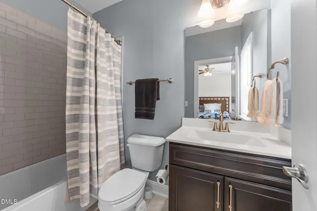 a front view of a house with a fountain