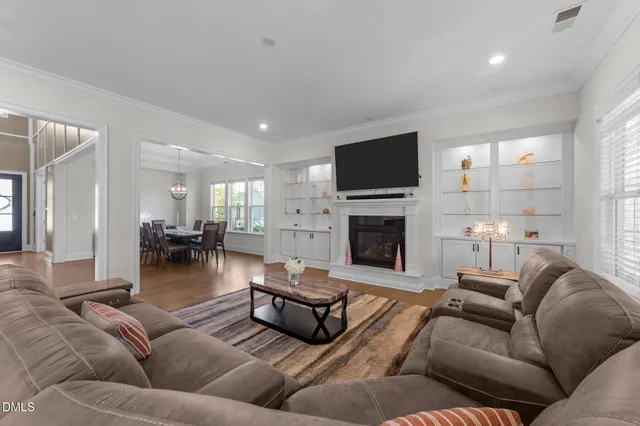 a large kitchen with stainless steel appliances lots of counter space and a sink
