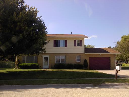 235 Phyllis Avenue Rochelle, IL 61068 - Photo 1 of 1 a front view of a house with a yard