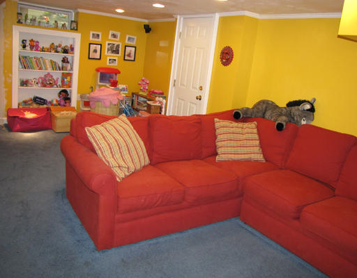 8 Bryn Mawr Road Wellesley, MA 02482 - Photo 12 of 16 a blue couch sitting in a room next to a blue wall