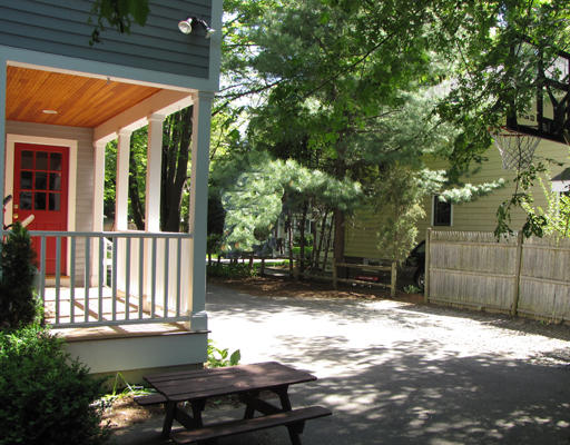 8 Bryn Mawr Road Wellesley, MA 02482 - Photo 13 of 16 a view of a small yard in front of a house with a large tree