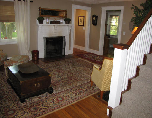 8 Bryn Mawr Road Wellesley, MA 02482 - Photo 3 of 16 a living room with furniture and a fireplace