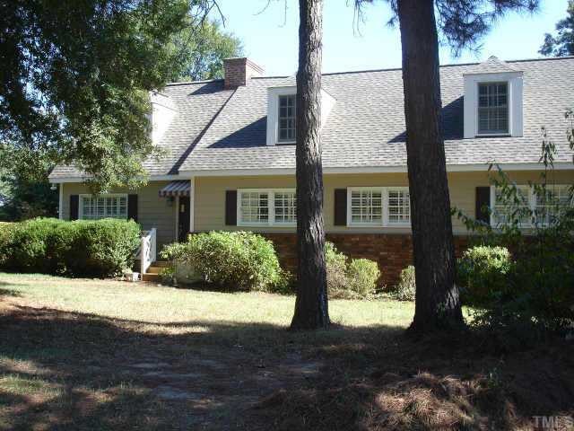 2710 Wilson Lane Raleigh, NC 27609 - Photo 1 of 1 a front view of a house with a yard and potted plants