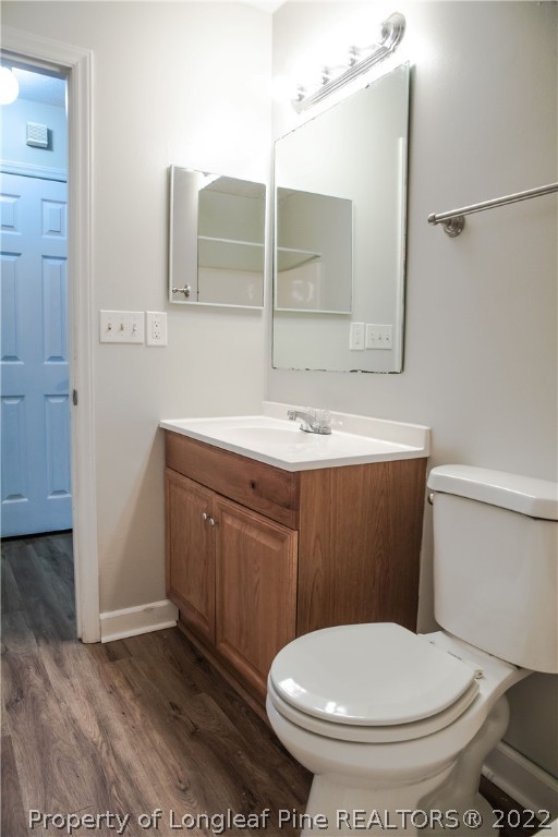 1017 Locks Creek Road Fayetteville, NC 28312 - Photo 16 of 26 a bathroom with a toilet sink and mirror