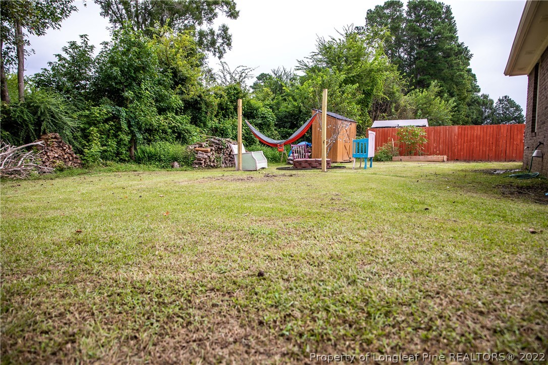 1017 Locks Creek Road Fayetteville, NC 28312 - Photo 20 of 26 a view of a house with a yard and sitting area