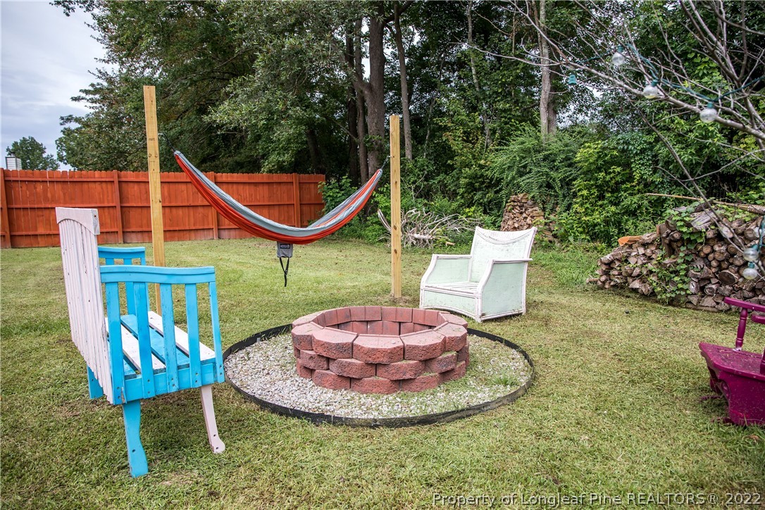 1017 Locks Creek Road Fayetteville, NC 28312 - Photo 21 of 26 a view of a chairs and table in the patio