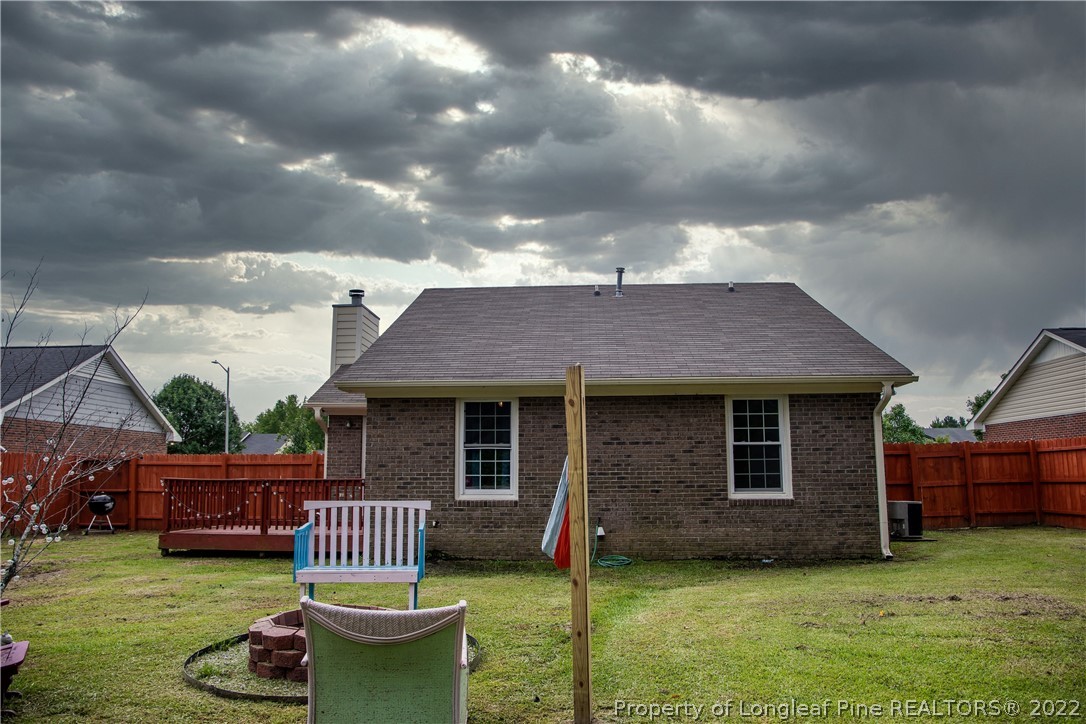 1017 Locks Creek Road Fayetteville, NC 28312 - Photo 26 of 26 a view of a house with backyard tub and sitting area