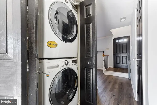 a view of a hallway with washer and dryer