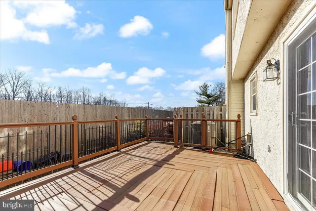 a view of a balcony with wooden floor