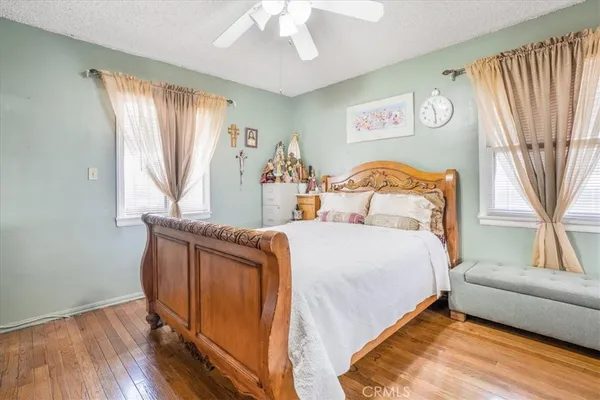 a bedroom with a bed and a couch