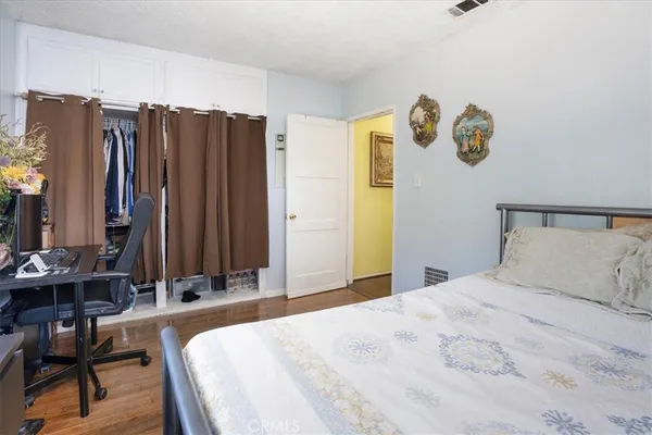 a bedroom with a bed and a table