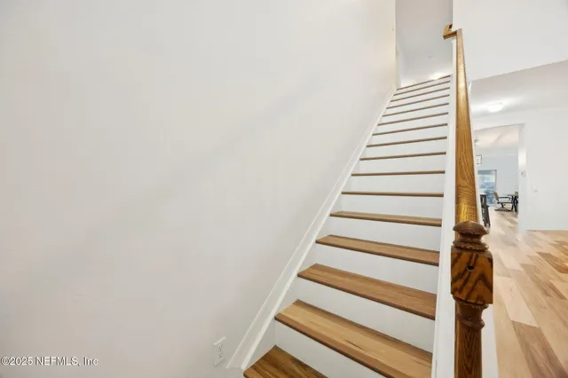 a view of a bathroom with a sink and a mirror