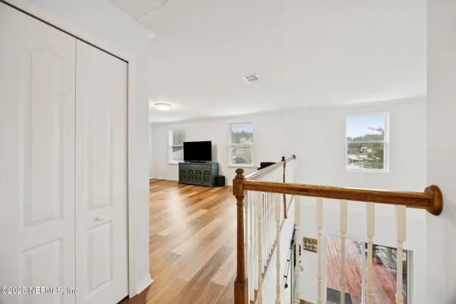 a living room with couches and a coffee table with wooden floor