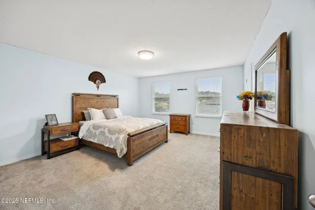 a sign that is sitting in front of flowers