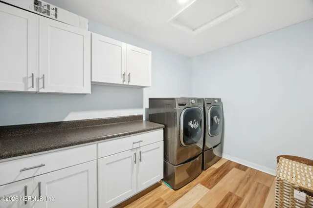 a living room with patio furniture and a large window