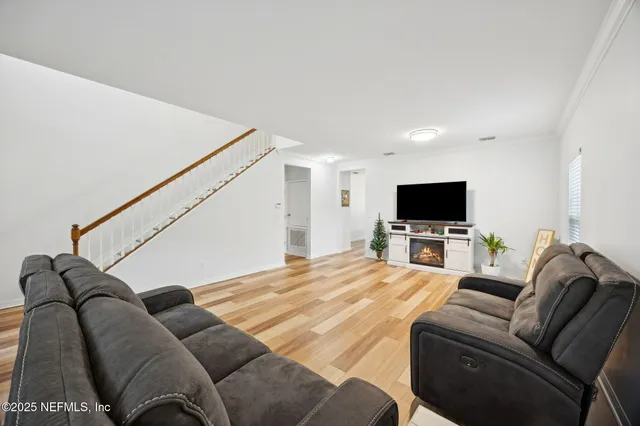 a spacious bedroom with a bed and a window